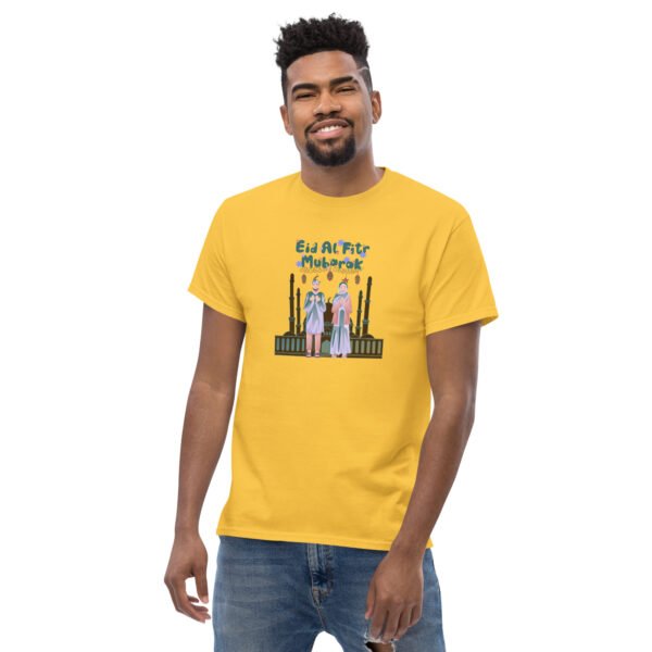 Man wearing yellow Eid Mubarak T-shirt with festive Arabic-inspired design