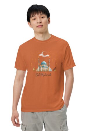 Man wearing orange Eid Mubarak garment-dyed heavyweight T-shirt