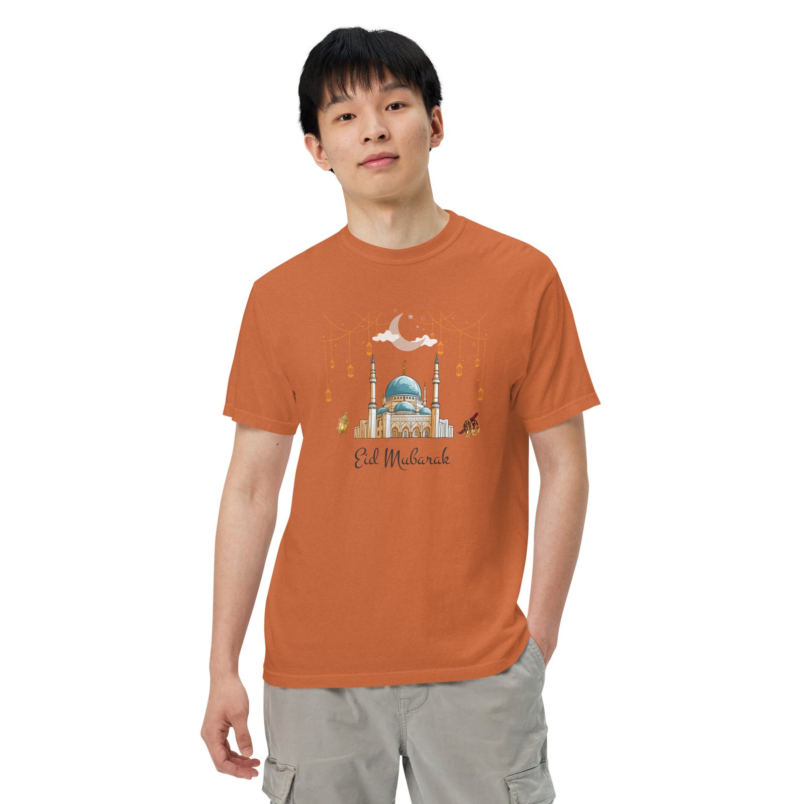 Man wearing orange Eid Mubarak garment-dyed heavyweight T-shirt
